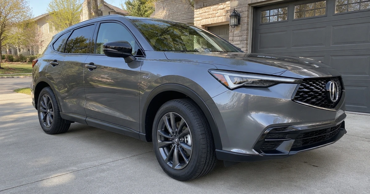 A close view of tires for Acura ADX fitted on a crossover in a driveway