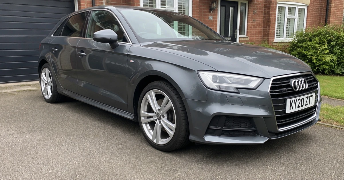 A close view of tires for Audi A3 fitted on a parked car beside a curb