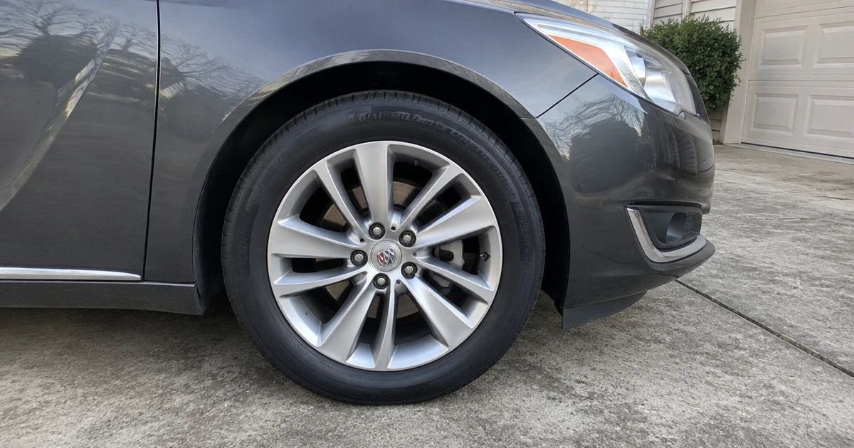 A Buick Regal parked outdoors shows how tires for Buick Regal look when fitted