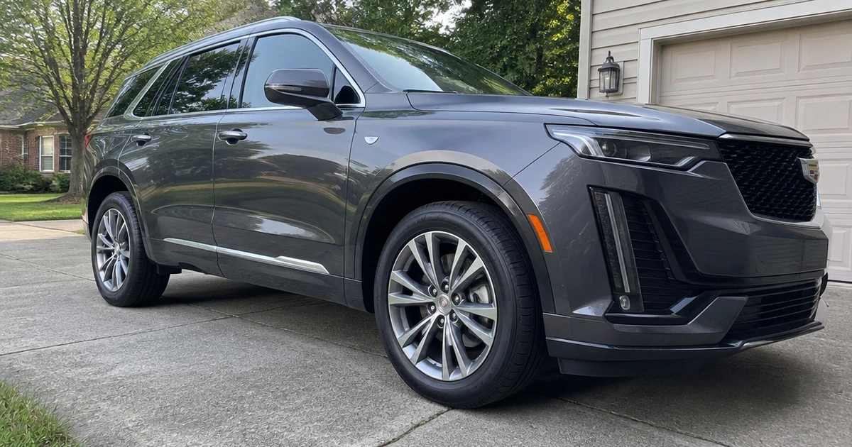 A close view shows tires for Cadillac XT6 fitted to a parked SUV