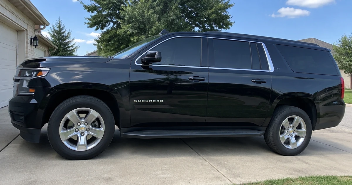 Tire for Chevy Suburban fitted to a family SUV in a sunlit driveway