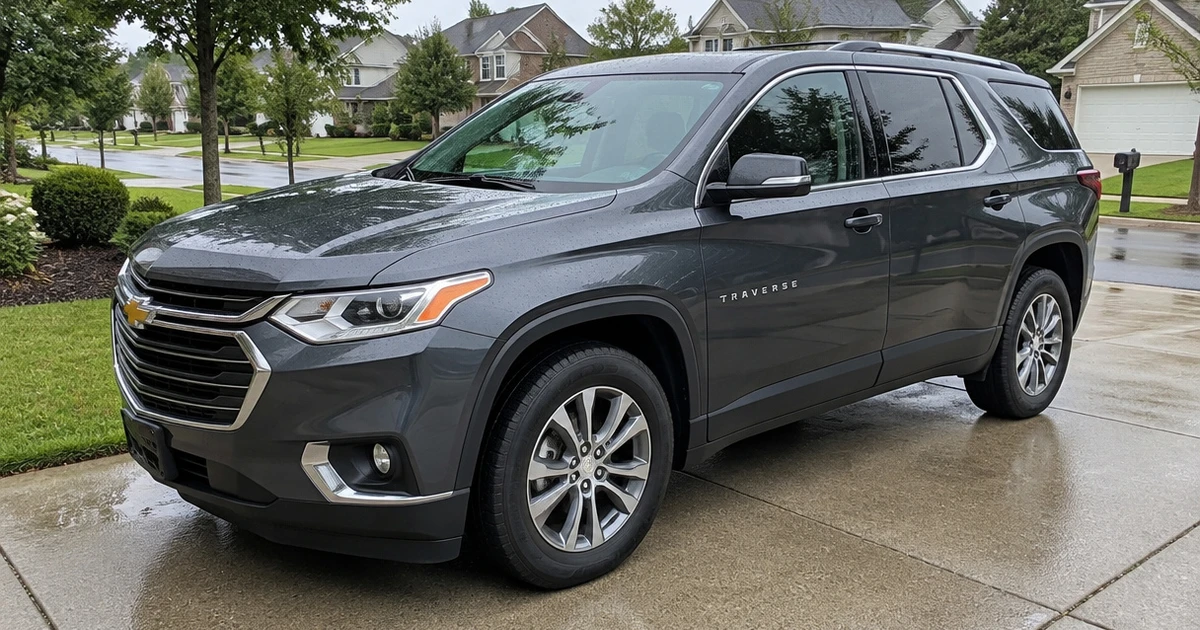 Tires for Chevy Traverse mounted on an SUV parked in a quiet driveway