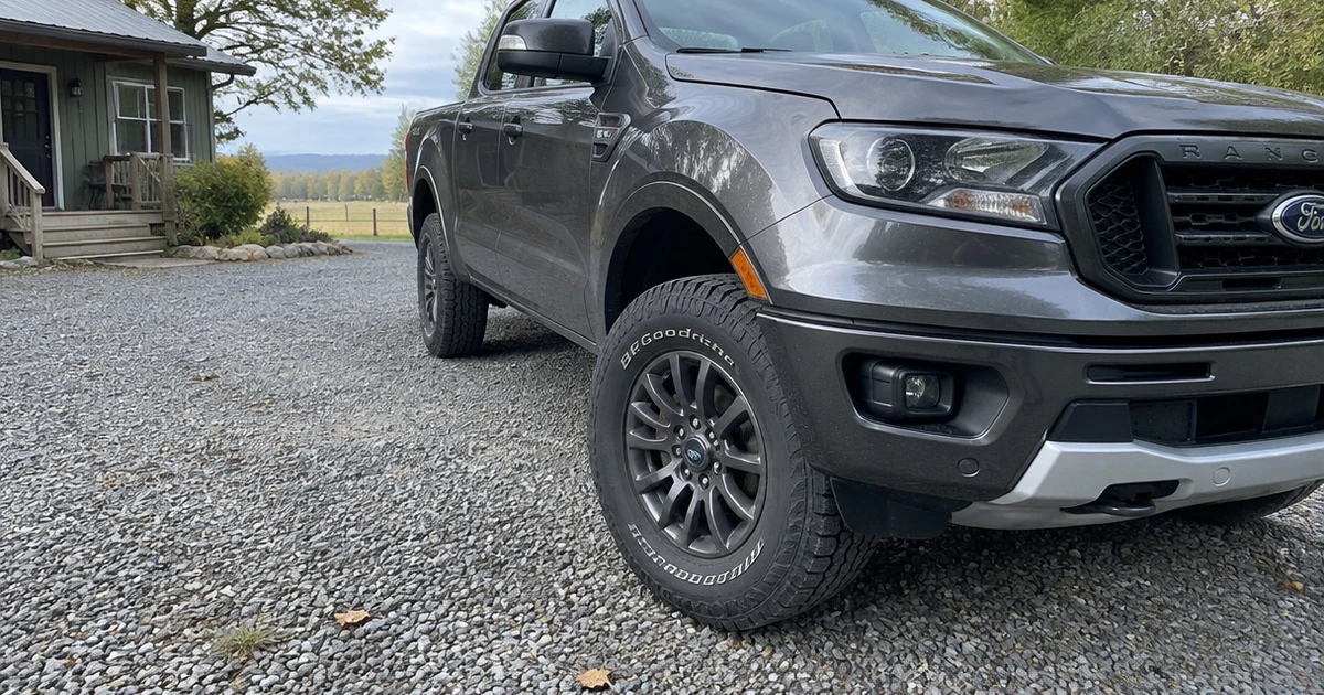 A Ford Ranger on a gravel driveway shows tires for Ford Ranger in use