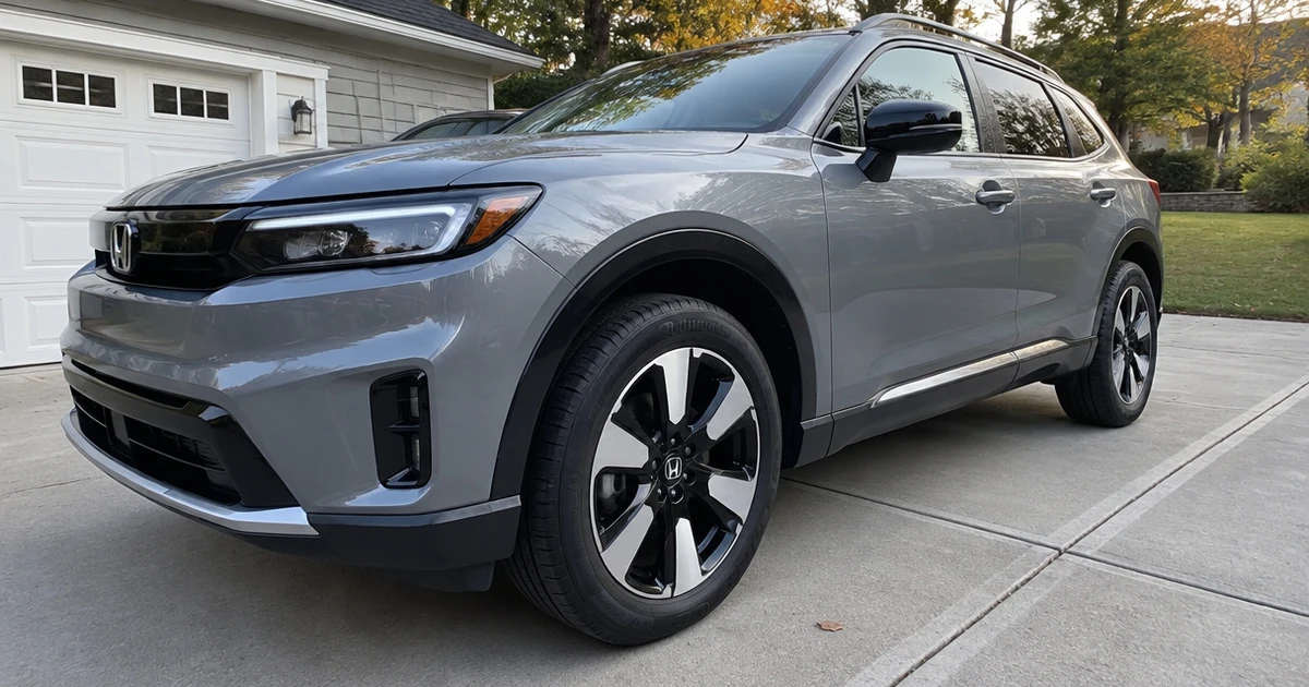 A Honda Prologue sits in a driveway with tires for Honda Prologue mounted on its wheels