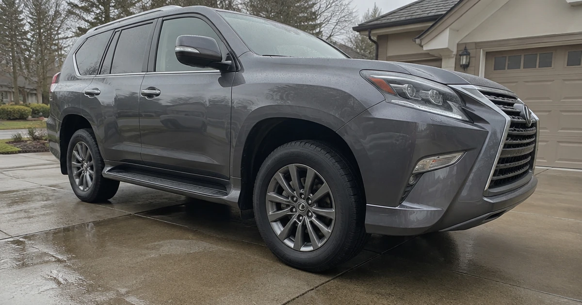 A Lexus GX on a driveway with tires for Lexus GX visible in natural light