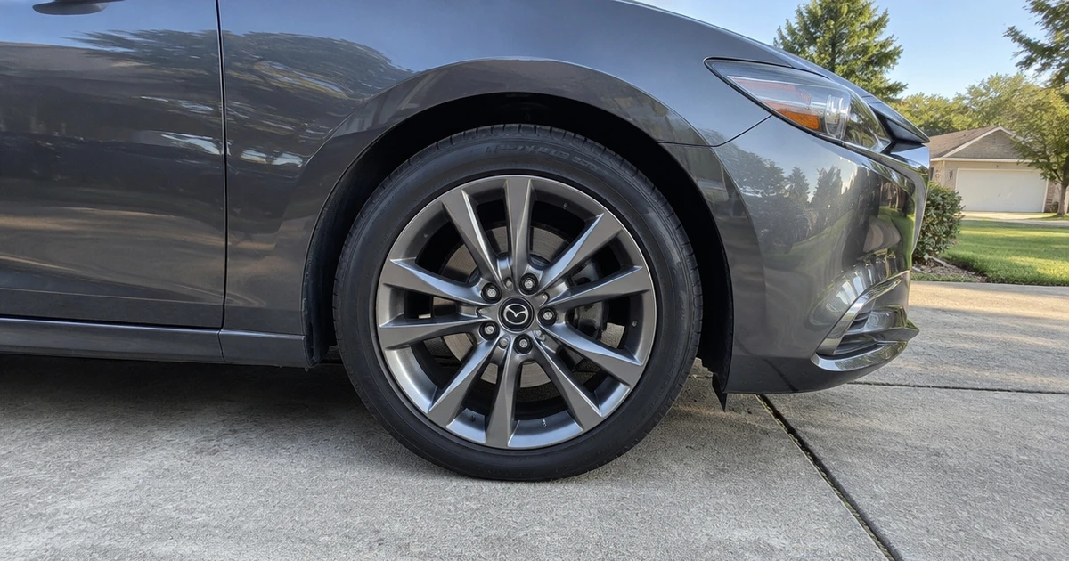 A Mazda 6 parked outside with tires for Mazda 6 fitted on its wheels