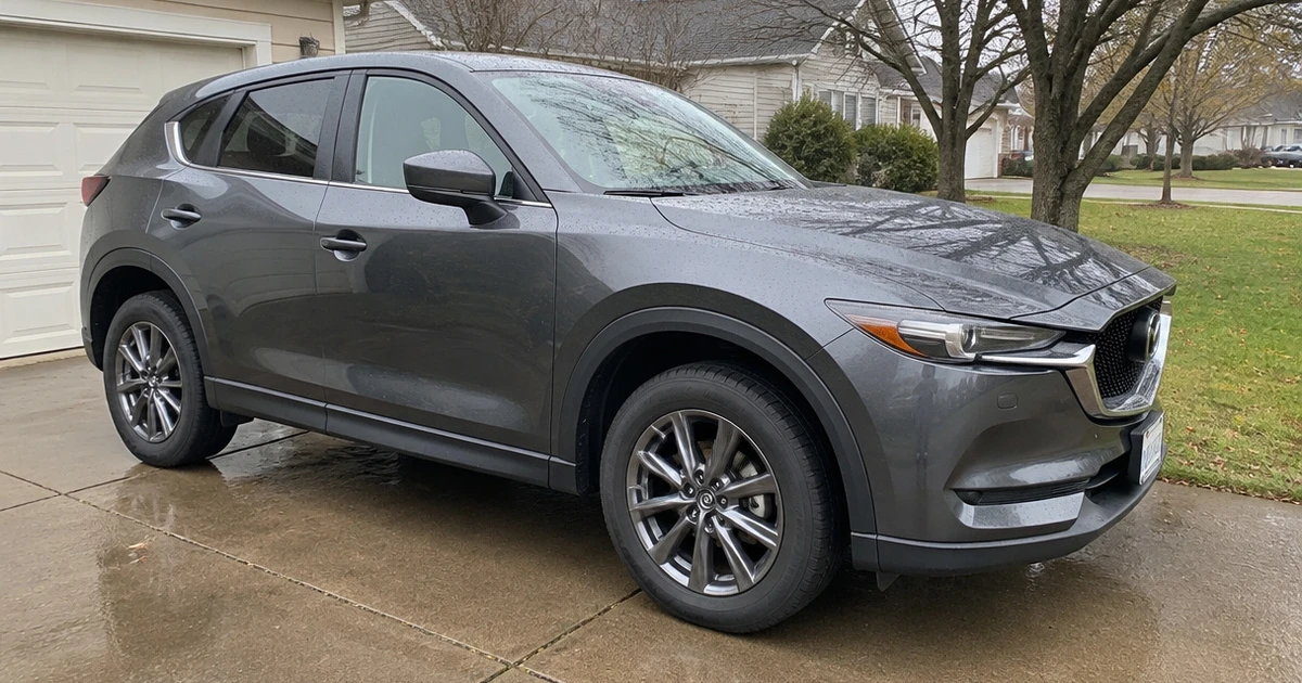 A close view of tires for Mazda CX-5 fitted to a parked crossover