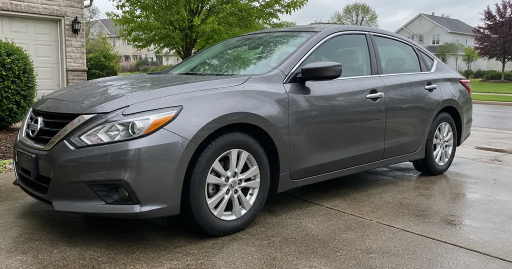 A close view shows a tire for Nissan Altima fitted to a parked sedan