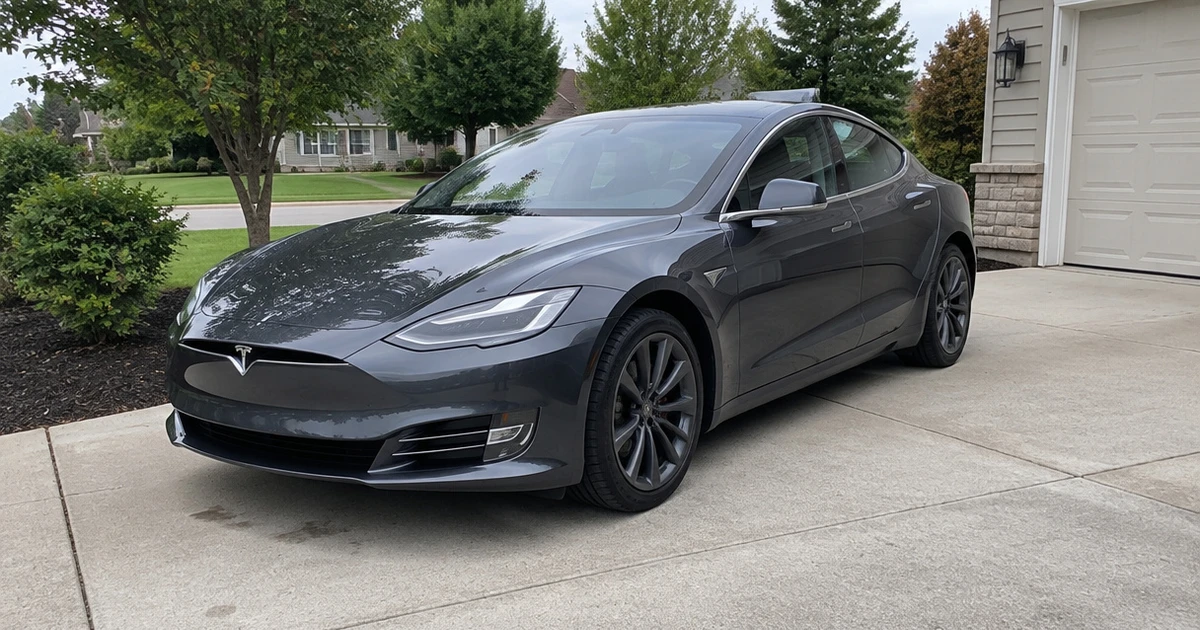 Close view of tires for Tesla Model S fitted to a car parked outside